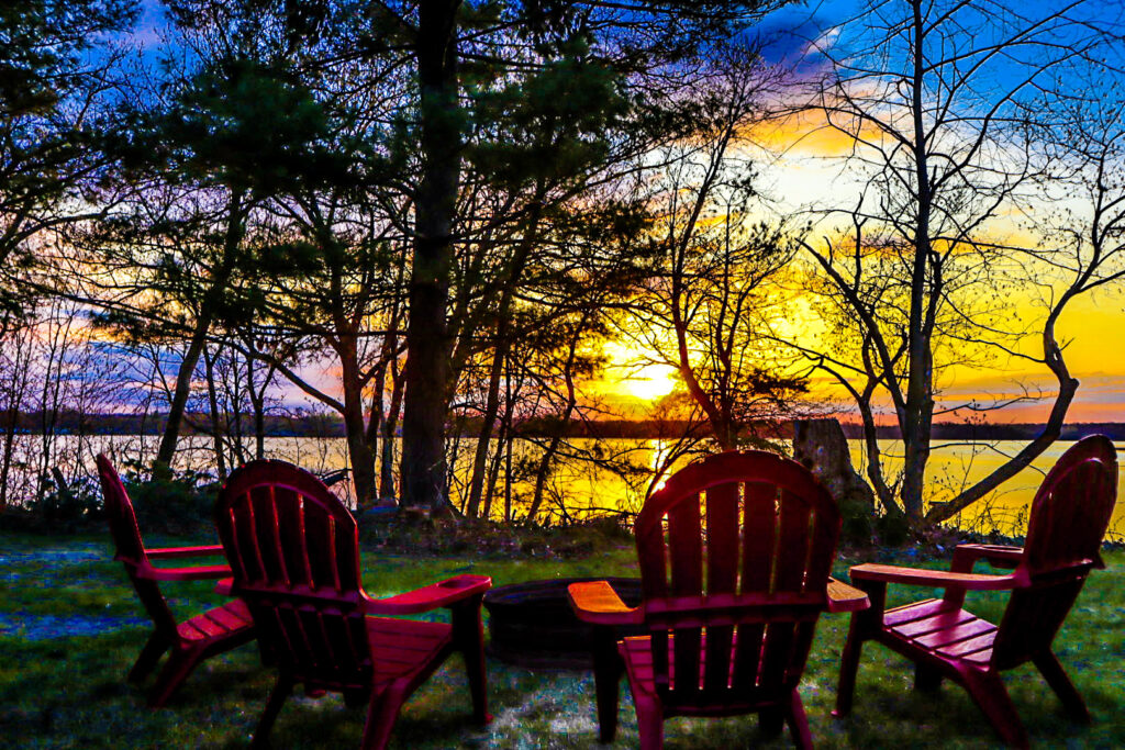 Sunset over the lake by the fire pit.